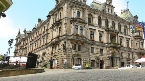 Vehicles on road along buildings