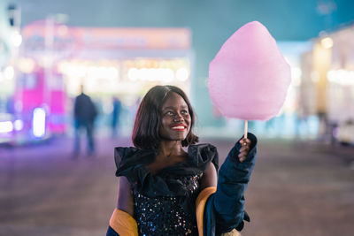 Cheerful african american woman with cotton candy