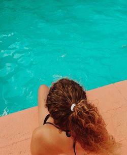 High angle view of woman by swimming pool