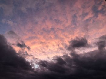 Low angle view of dramatic sky during sunset