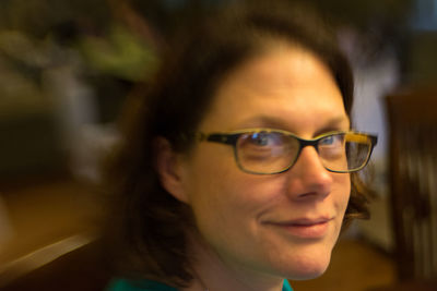 Close-up portrait of woman wearing eyeglasses