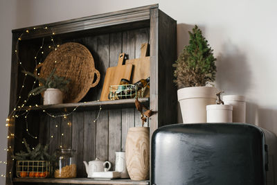 Christmas decor in the stllovaya or kitchen. cupboard with dishes and spruce or fir branches