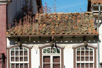 Low angle view of house window on building