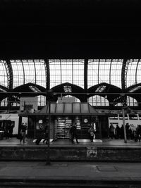 People walking on railroad station platform