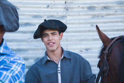 Portrait of smiling man wearing hat