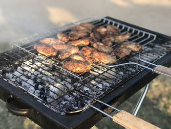 High angle view of meat on barbecue grill