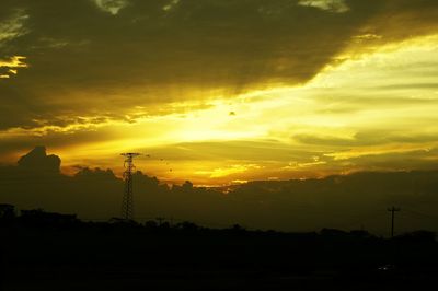 Silhouette of landscape against dramatic sky
