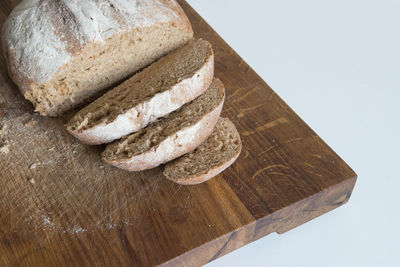 High angle view of bread on cutting board