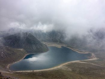 Scenic view of mountains against sky and lagoon 