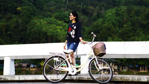 Portrait of woman riding bicycle