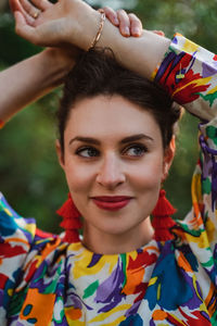 Close-up portrait of smiling young woman