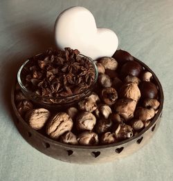 High angle view of coffee beans in bowl on table