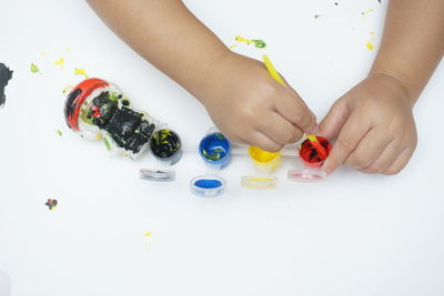 High angle view of baby hand on table