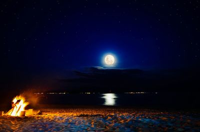 Scenic view of sea against sky at night