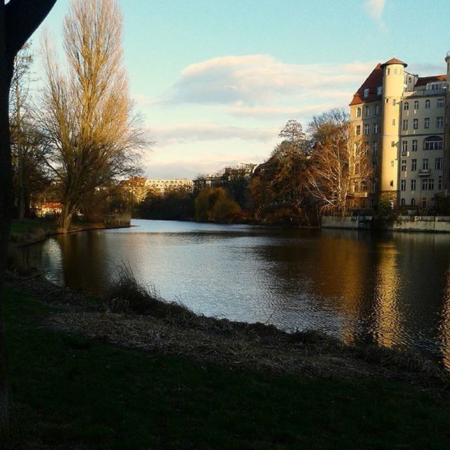 building exterior, architecture, water, built structure, tree, reflection, sky, lake, river, city, bare tree, waterfront, building, canal, nature, outdoors, riverbank, rippled, residential building, no people