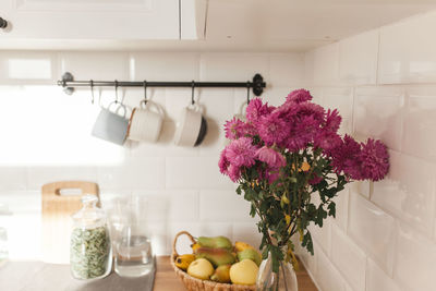 Flower vase on table at home