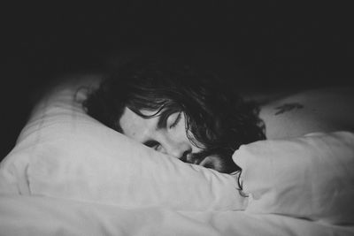 Close-up of woman sleeping on bed