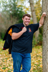 Portrait of young man in park