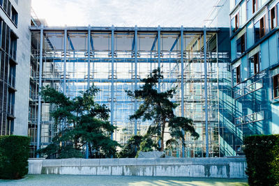 Modern glass building against sky