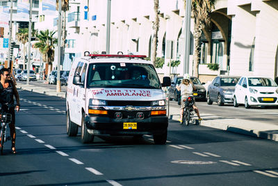 Vehicles on road along buildings