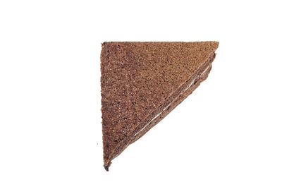Close-up of chocolate cake against white background