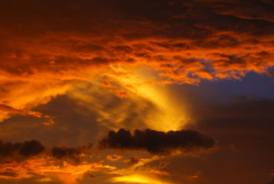 Low angle view of dramatic sky during sunset