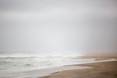 Lone person angling on the skeleton coast, namibia