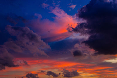 Low angle view of dramatic sky during sunset