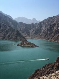 Scenic view of mountains against clear blue sky