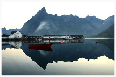 Boats moored at harbor