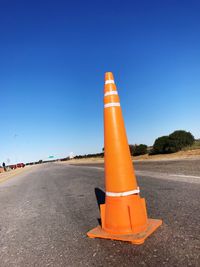 Road signal against blue sky