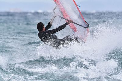 Man surfing on sea