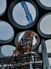 Low angle view of ferris wheel against sky