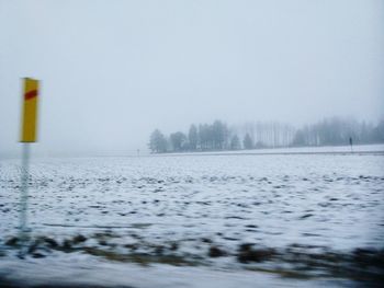 Scenic view of trees against sky during winter
