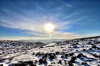 Scenic view of snowcapped mountains against sky during winter