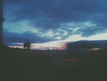 Scenic view of landscape against cloudy sky