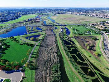 High angle view of agricultural landscape against sky