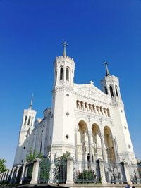 Low angle view of building against blue sky