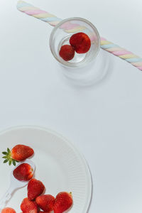 High angle view of strawberries in glass on table