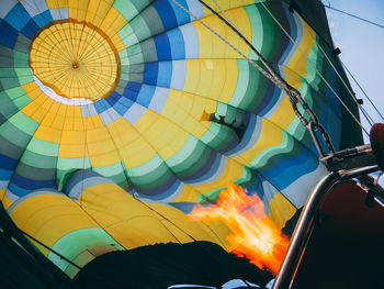 Low angle view of multi colored hot air balloon against sky