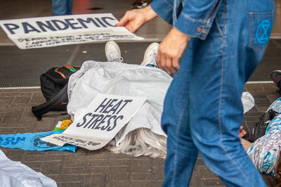 Low section of people standing on street