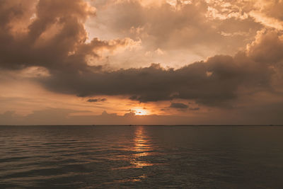 Scenic view of sea against sky at sunset