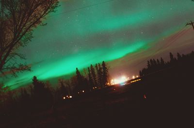 Scenic view of landscape against sky at night