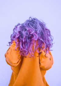 Rear view of a girl with purple hair