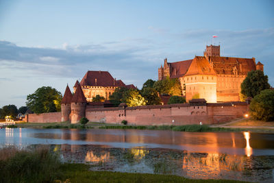 Reflection of building in lake marienburg deutschorden