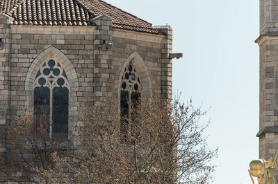 Low angle view of old building against clear sky