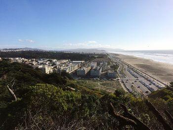 High angle view of city by sea