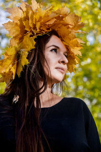 Portrait of young woman looking away