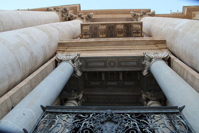 Low angle view of statue against historic building