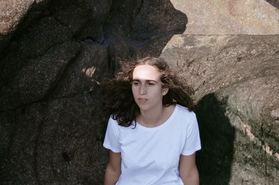 Portrait of young woman standing outdoors